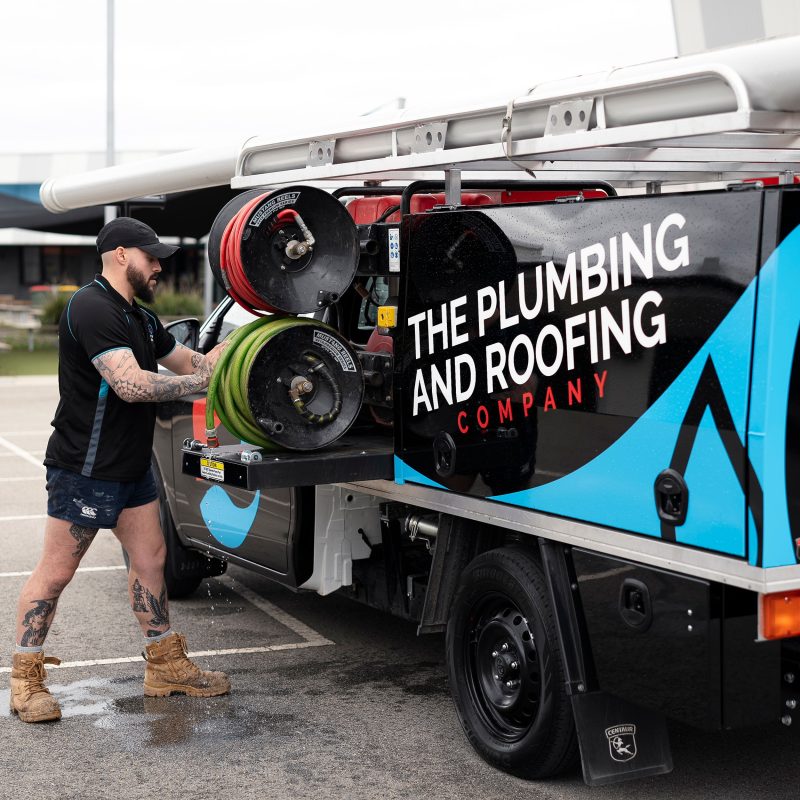 Plumber with a drain jetting trailer
