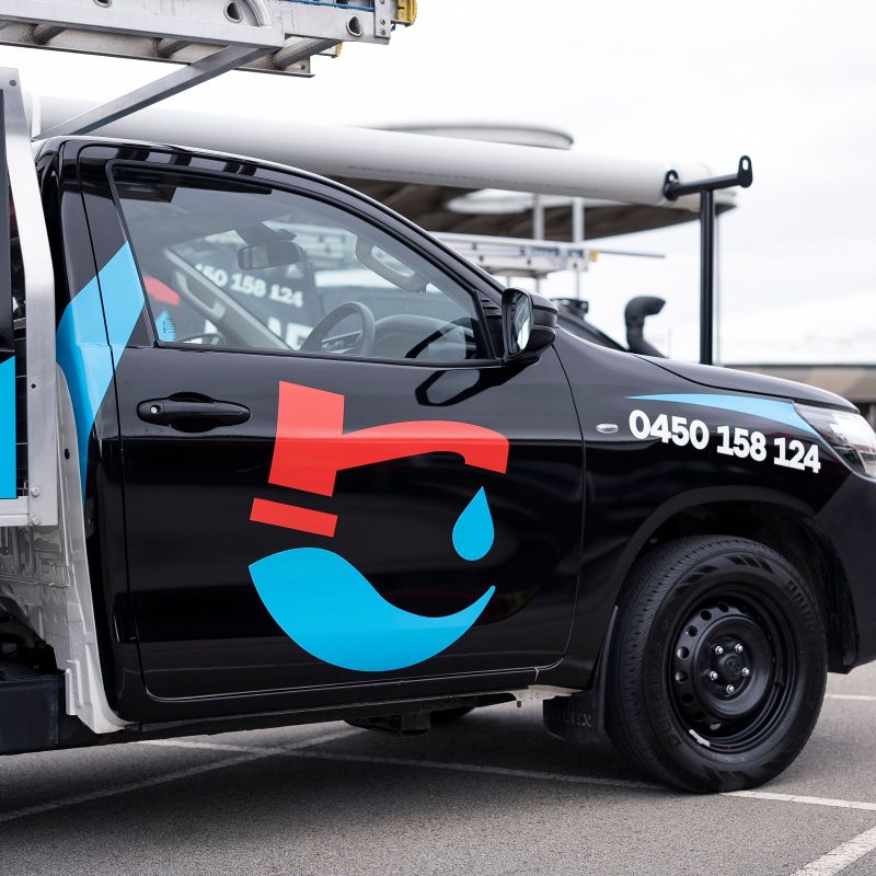 The Plumbing and Roofing Company branded van