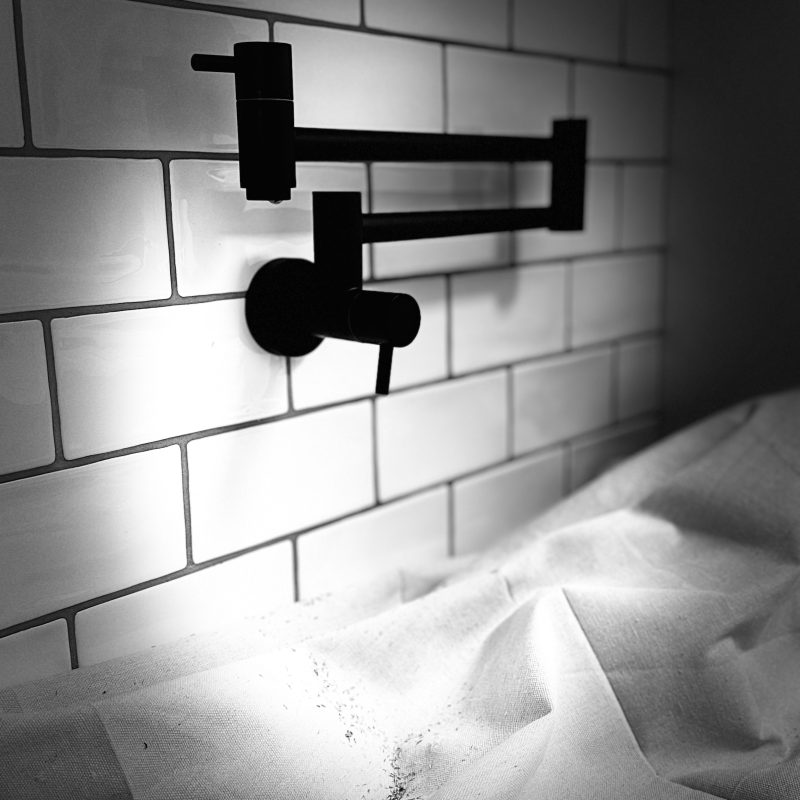 Modern black wall-mounted tap