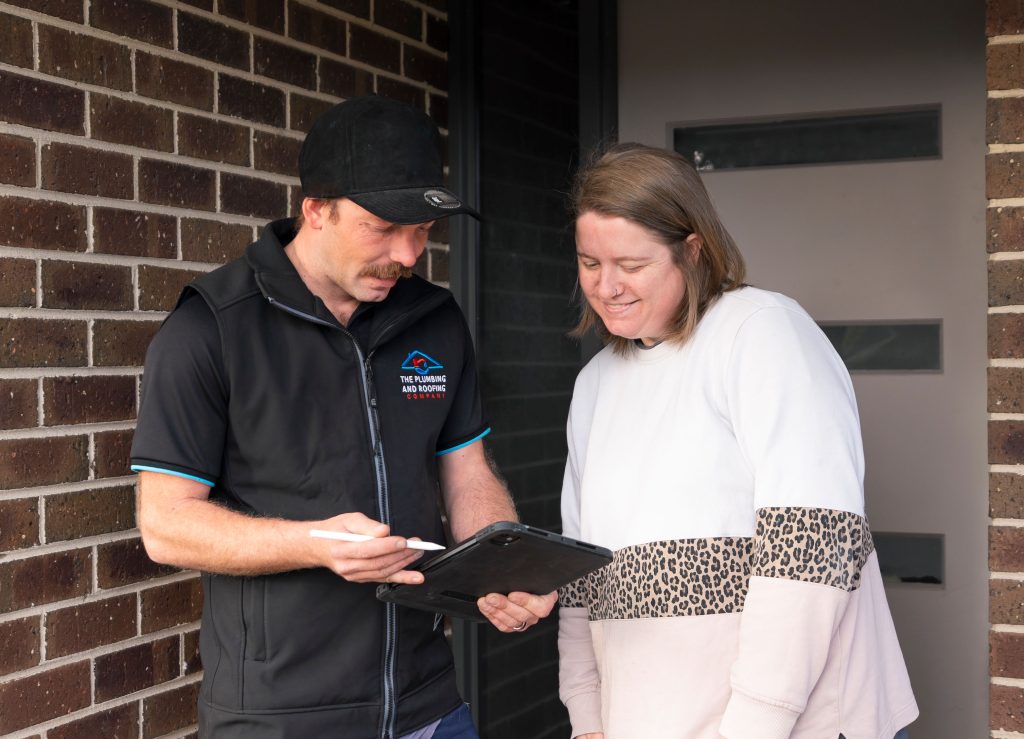 Licensed plumber talking a Melbourne homeowner through the job